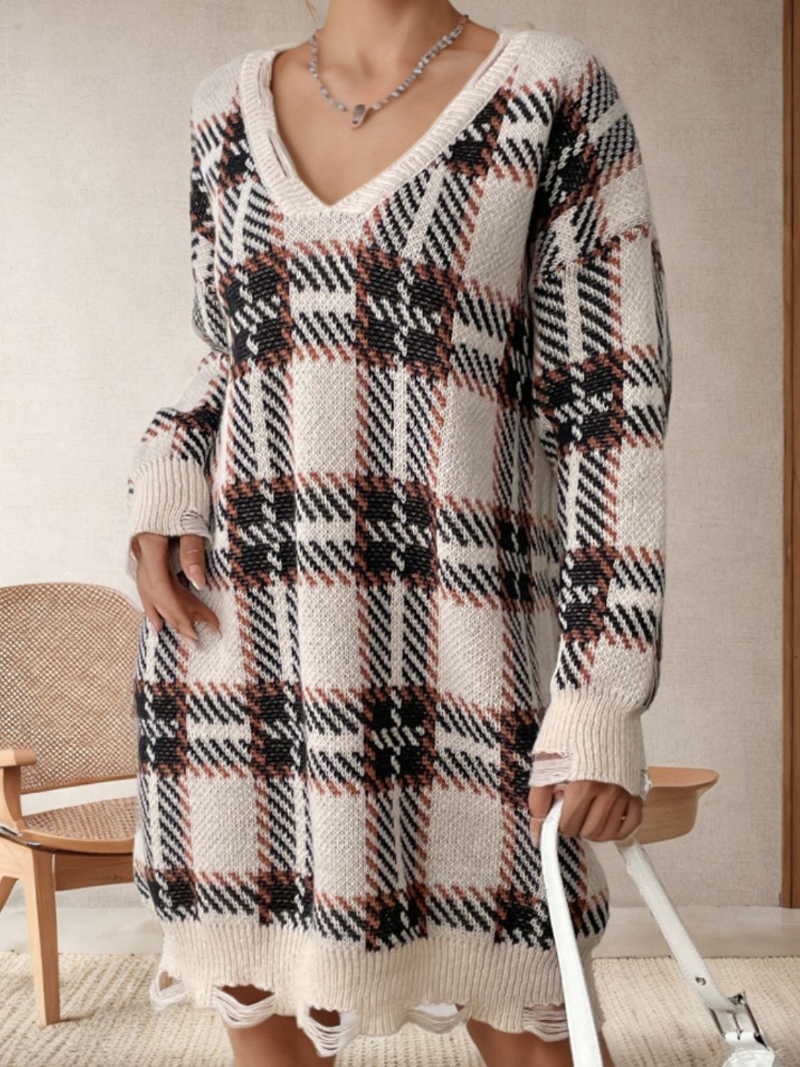 BELLA BLA distressed plaid v-neck long sleeve sweater dress with a casual, trendy style and relaxed fit.