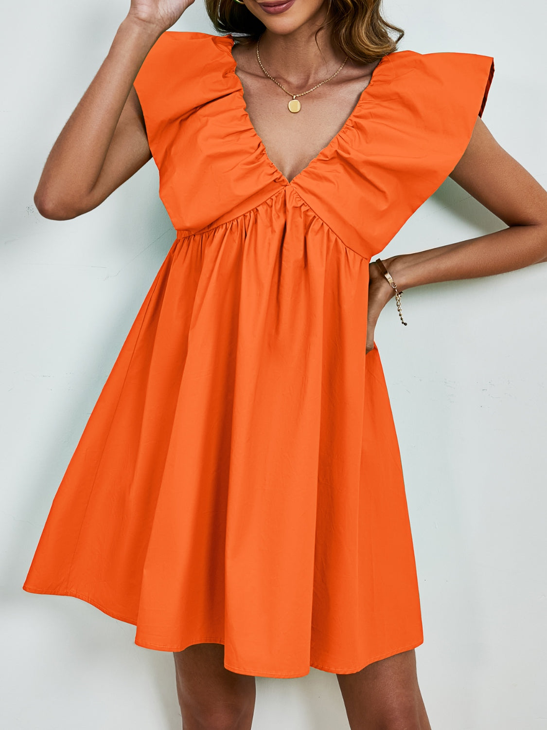 BELLA V-neck cap sleeve mini dress featuring a stylish fit and flowy fabric, perfect for casual or semi-formal occasions.