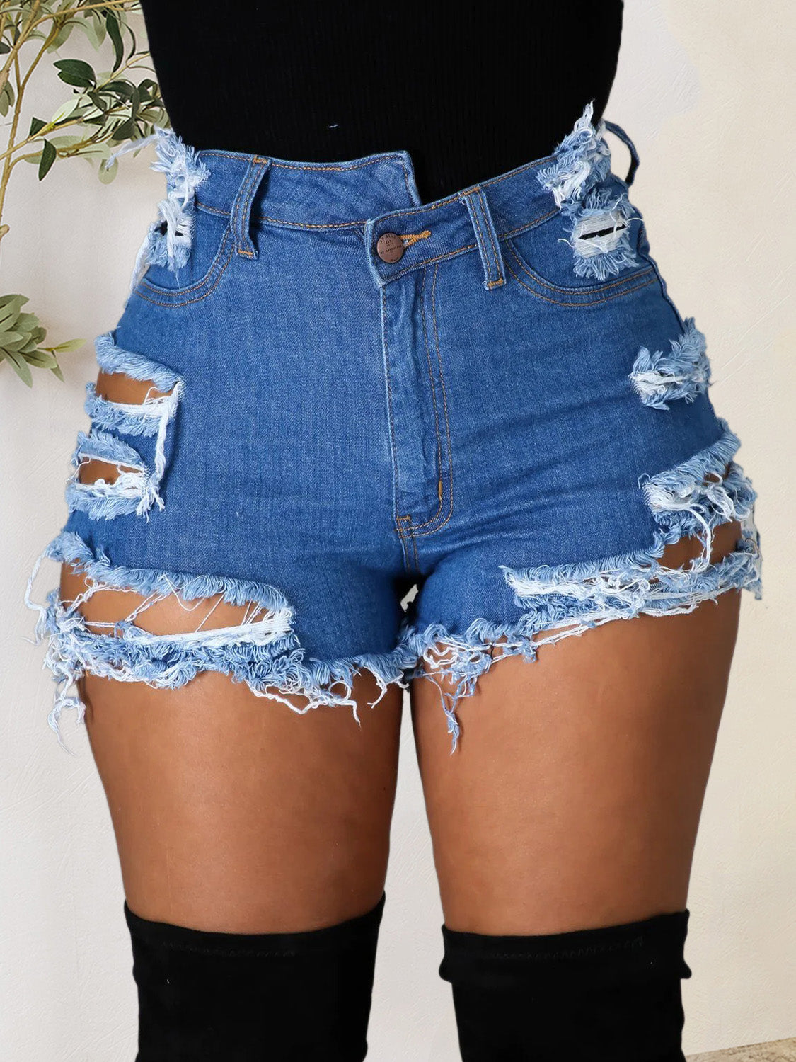 BELLA distressed raw hem denim shorts with front and back pockets, casual style, featuring frayed edges and light wash denim.