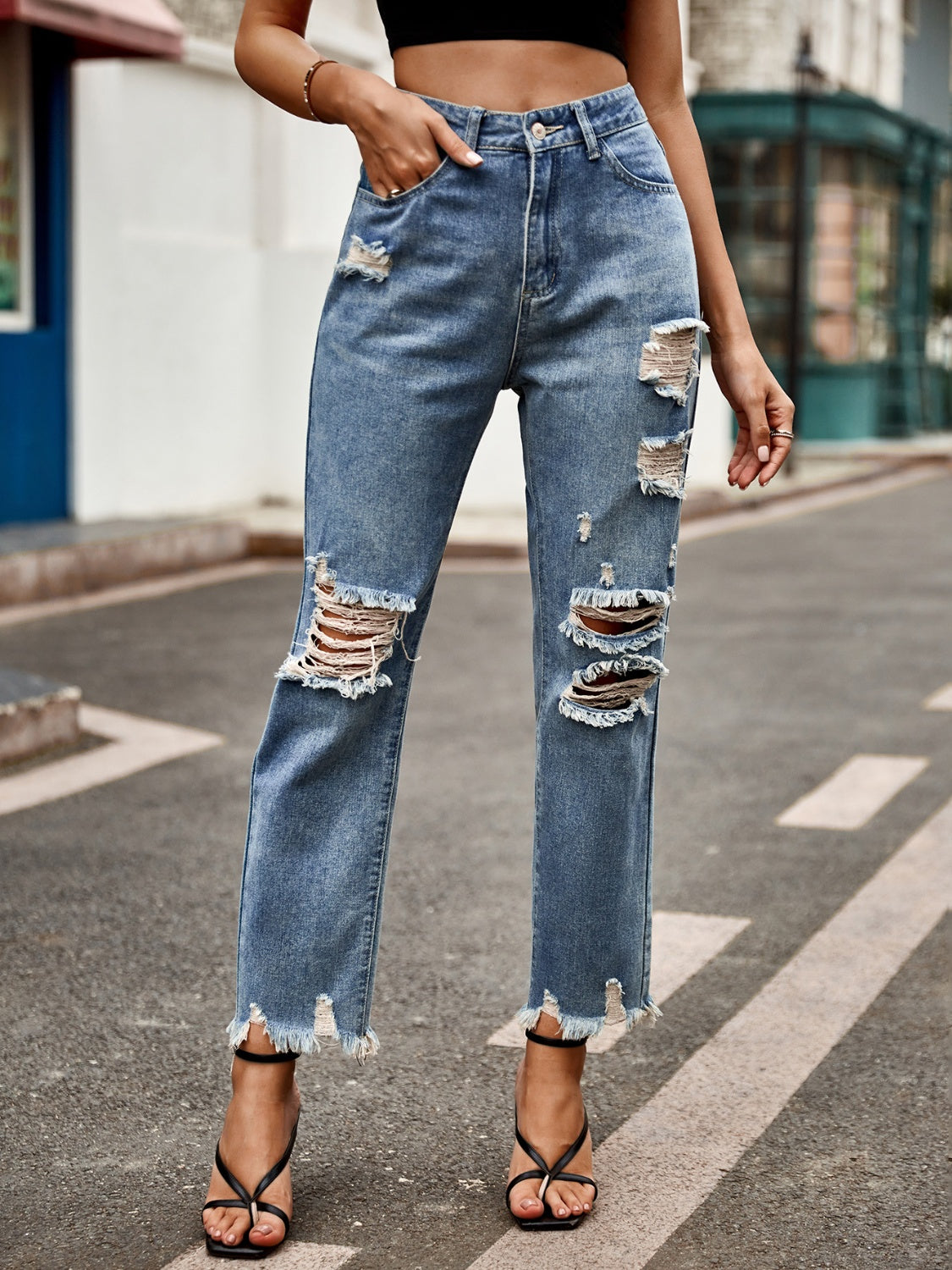 Distressed raw hem jeans by BELLA BLA featuring a trendy fit, with faded details and frayed hems on light denim.