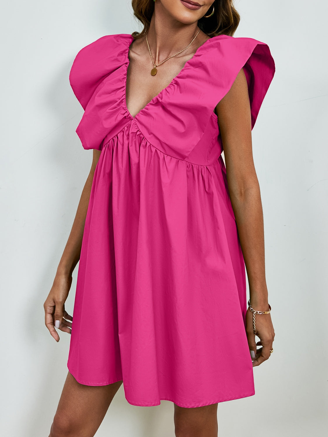 BELLA V-neck cap sleeve mini dress featuring a fitted silhouette and stylish design, perfect for casual or semi-formal occasions.