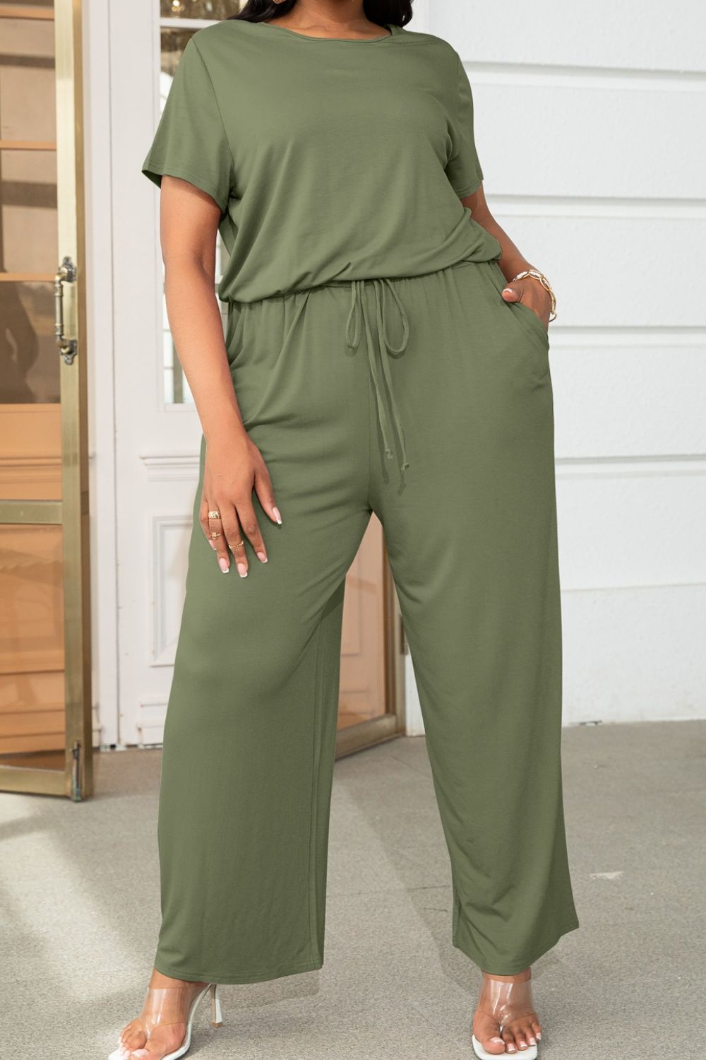 Plus size BELLA drawstring waist short sleeve jumpsuit, casual outfit with a comfortable fit and stylish design.
