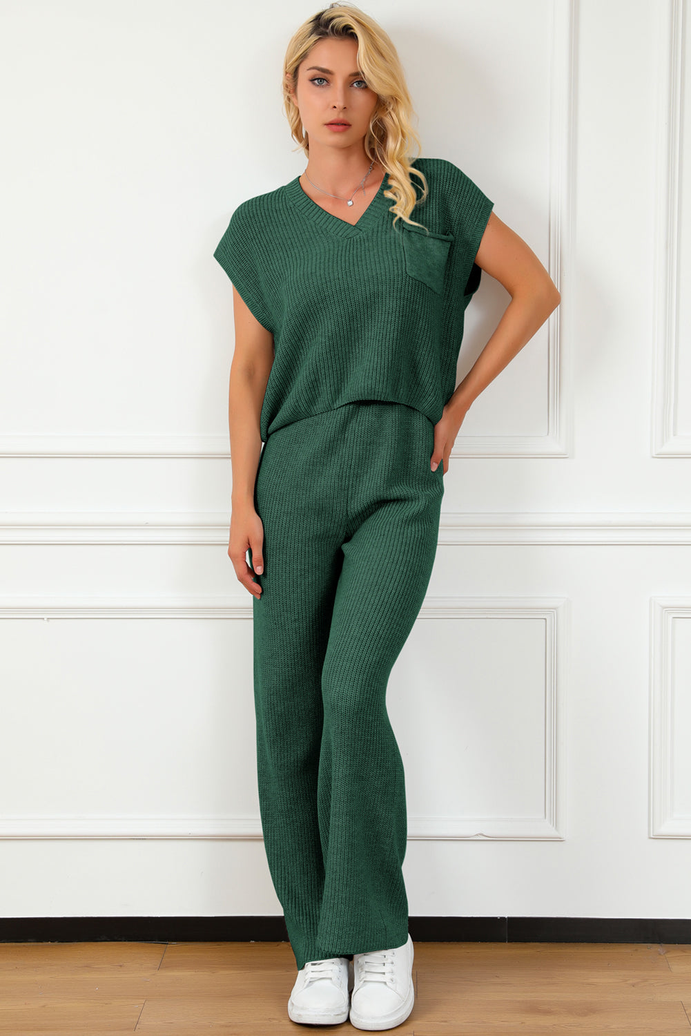 BELLA trendsi pocketed V-neck top and wide-leg sweater set laid flat, showing soft knit fabric and stylish design details.