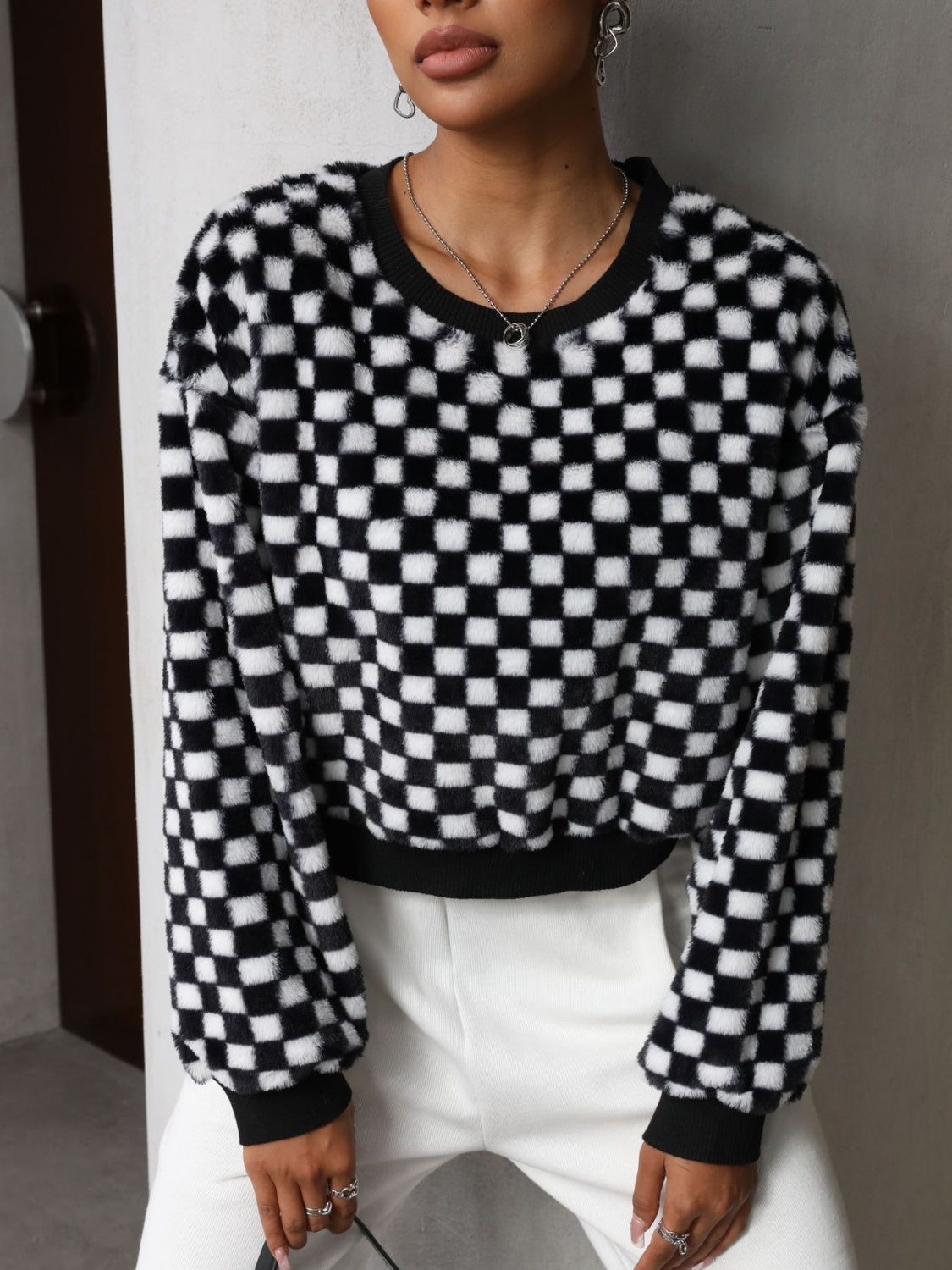 BELLA plaid round neck long sleeve sweater with a classic check pattern, casual and cozy for everyday wear.