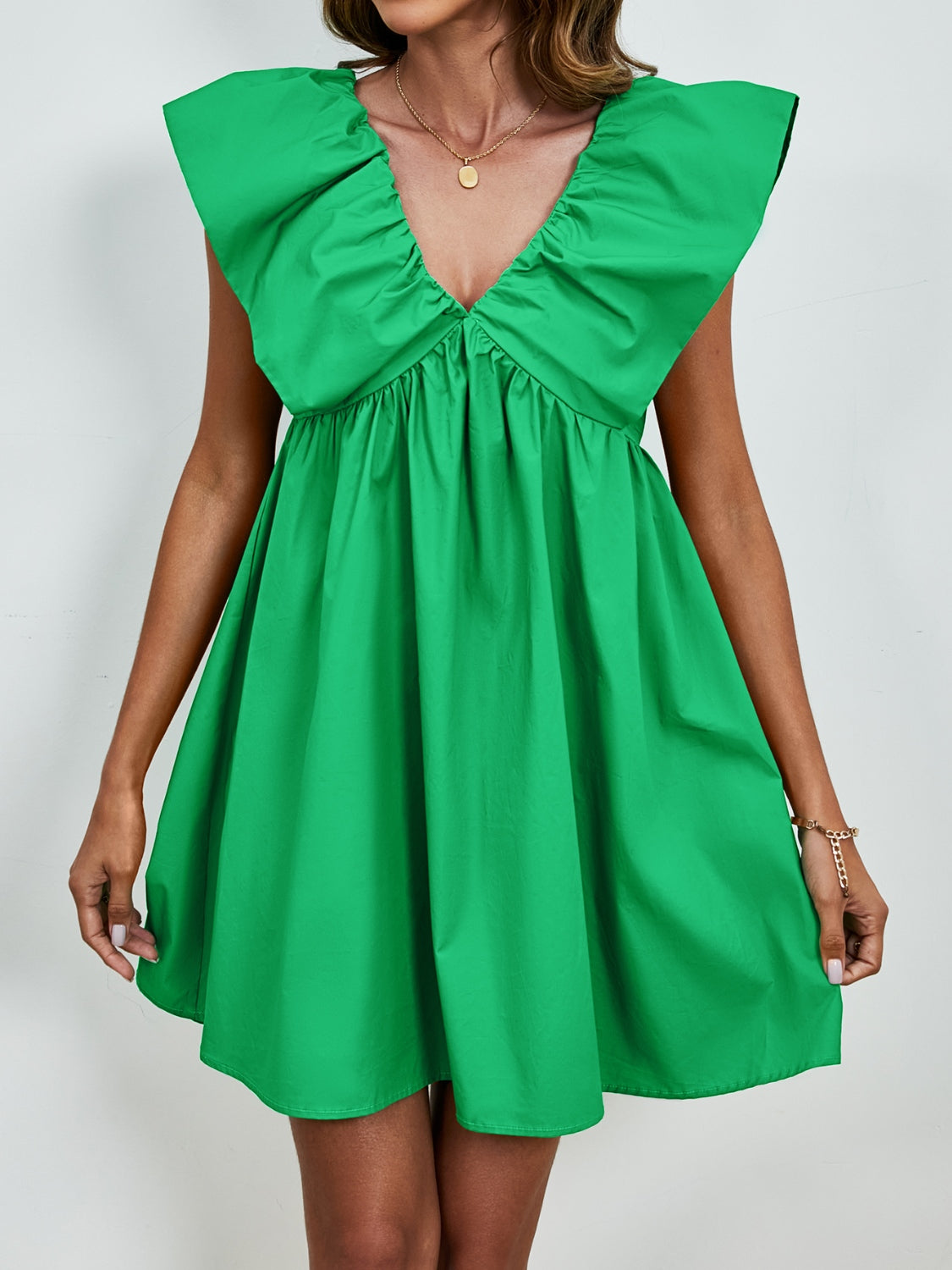 BELLA V-neck cap sleeve mini dress from Trendsi, featuring a stylish V-neckline and fitted cap sleeves in a chic mini length.