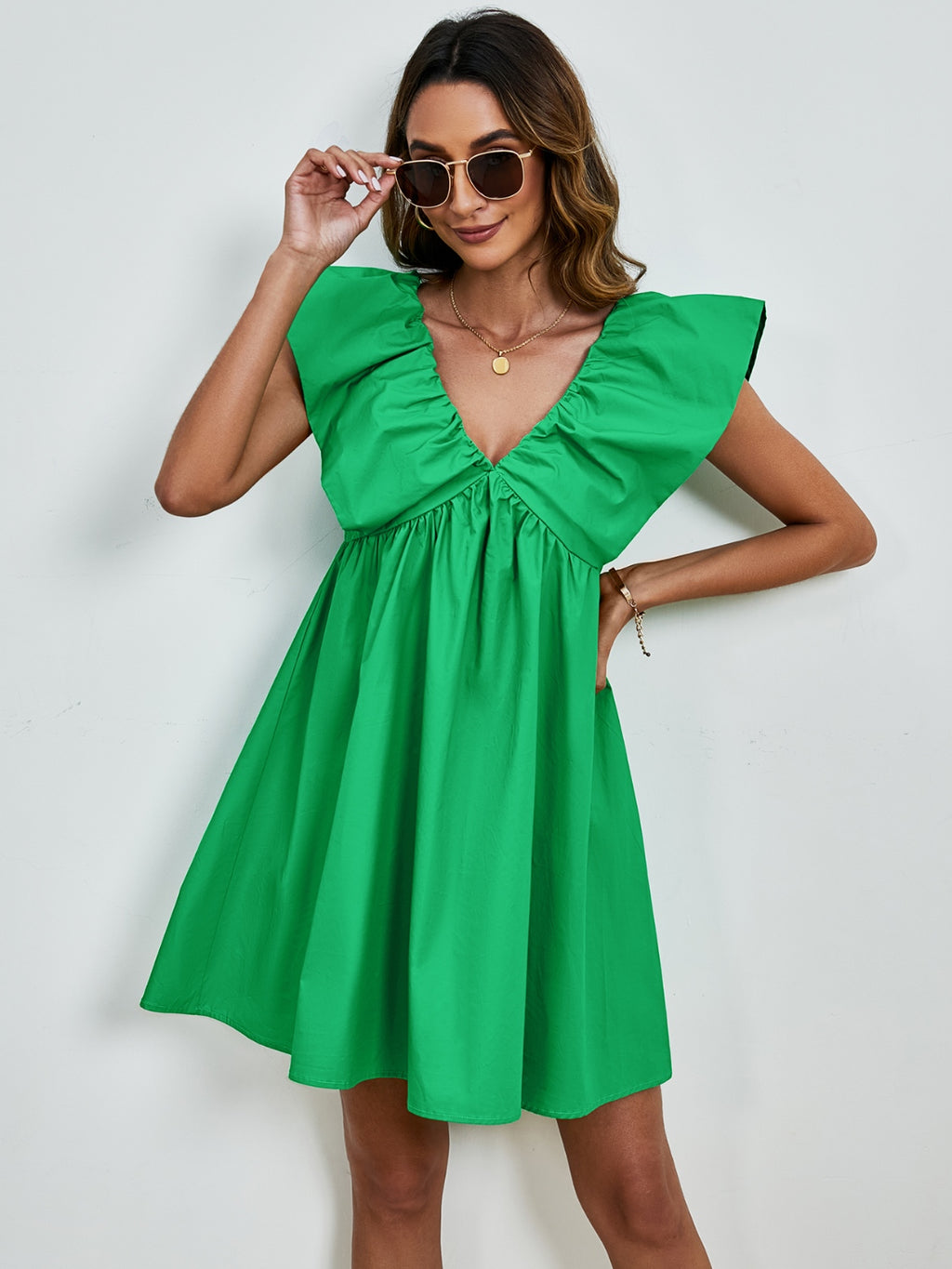BELLA V-neck cap sleeve mini dress from Trendsi, featuring a fitted silhouette and stylish design, perfect for casual or semi-formal wear.