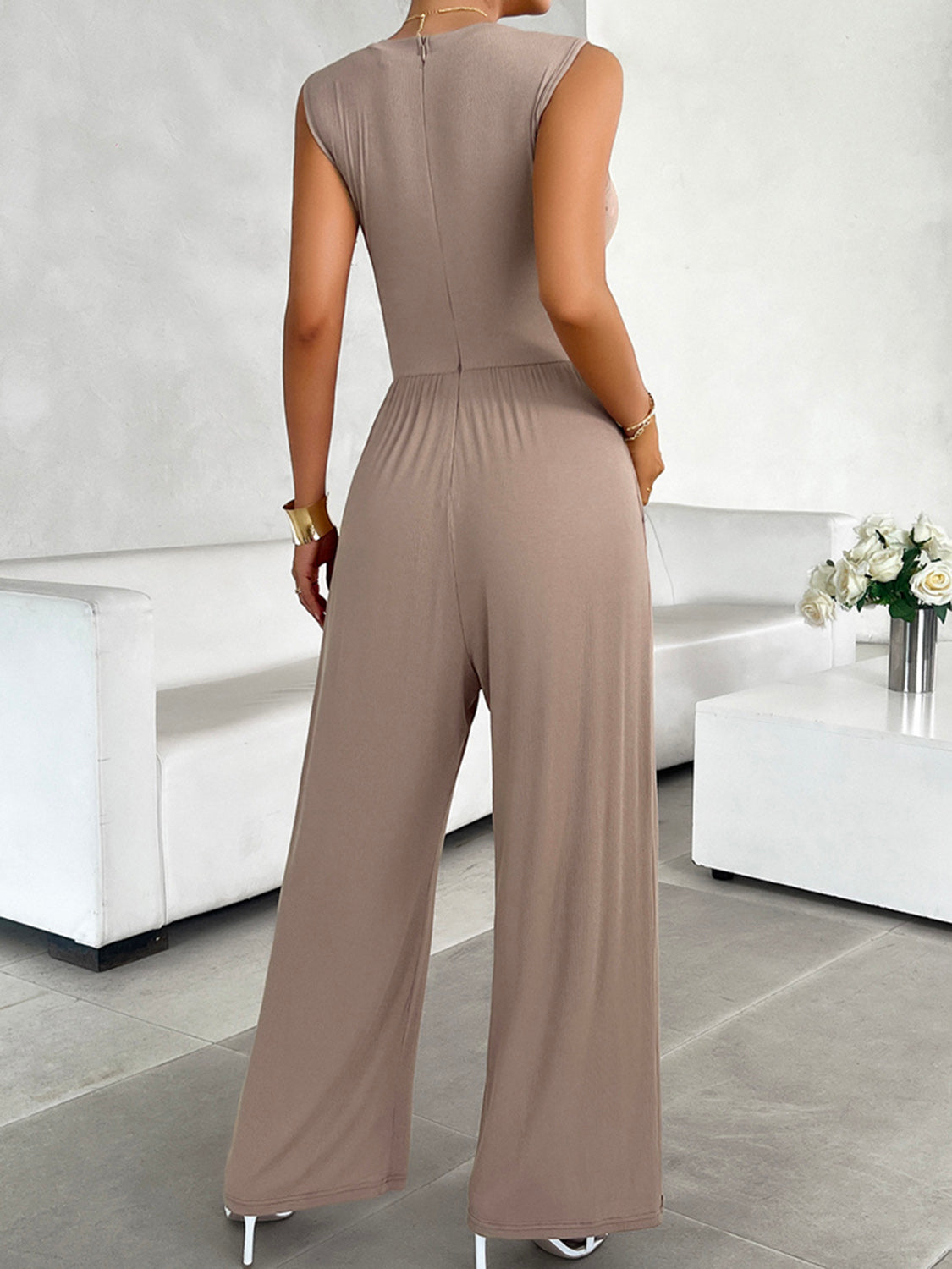 BELLA trendsi round neck sleeveless wide-leg jumpsuit displayed on a model, showcasing its relaxed fit and stylish design.