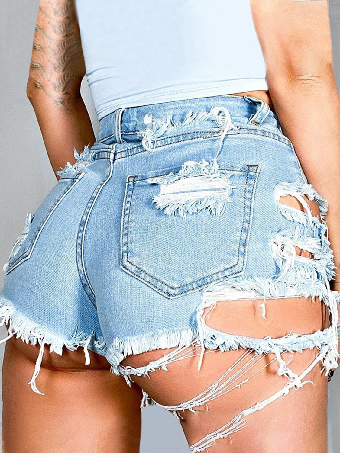 Distressed raw hem denim shorts with pockets from BELLA, featuring a trendy, casual fit and frayed hem detail.