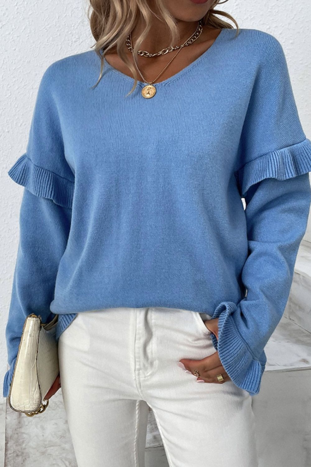 BELLA V-Neck Ruffle Trim Long Sleeve Sweater from trendsi, featuring a soft knit fabric, ruffle details at the neckline, and long sleeves.