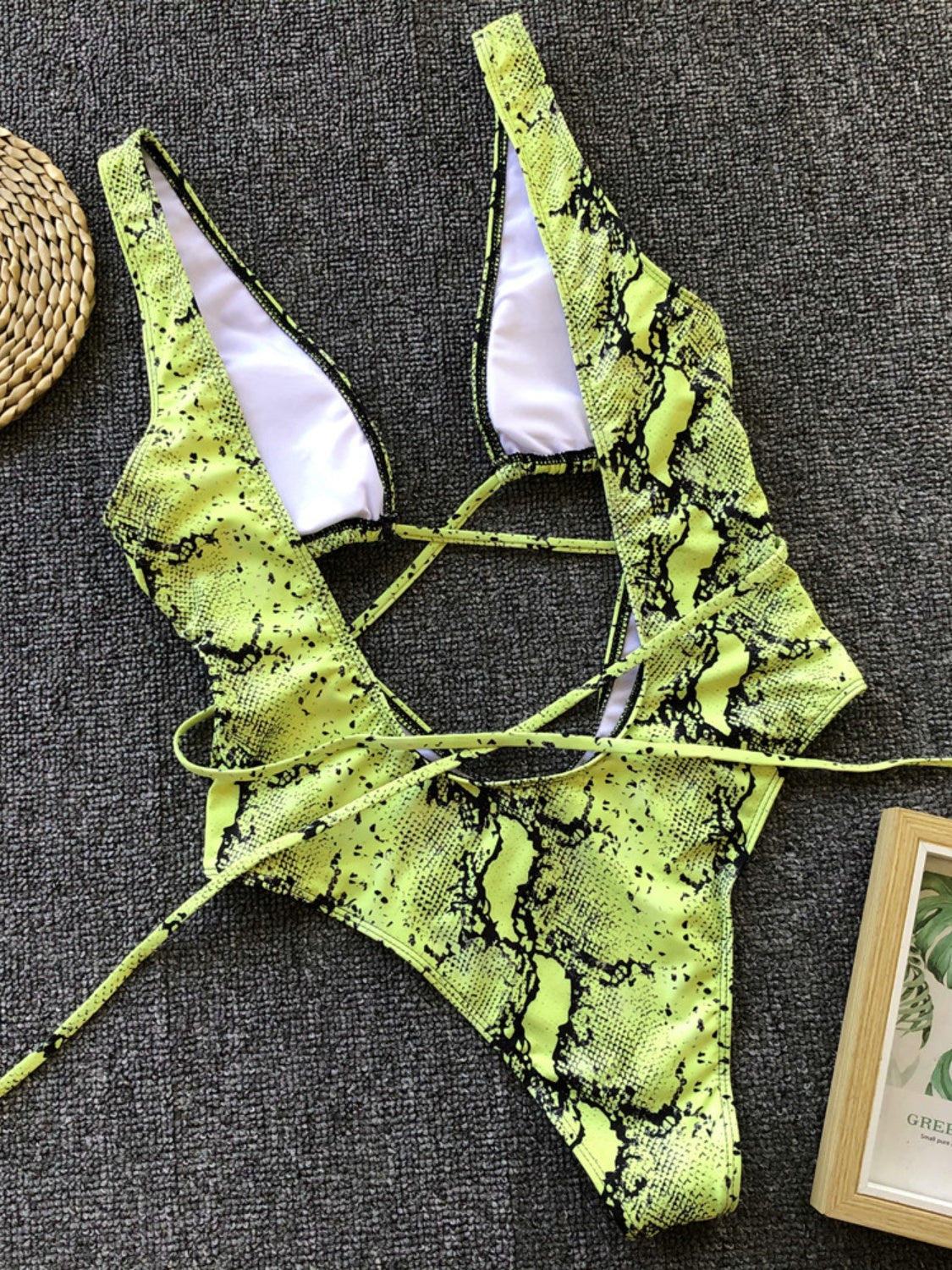 BELLA Lace-Up Backless Plunge One-Piece Swimwear featuring a stylish design with lace-up details and a plunging neckline.