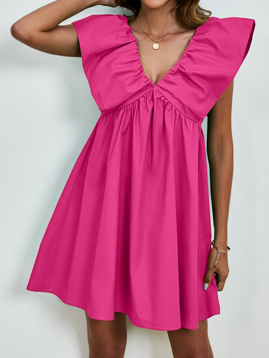 BELLA V-neck cap sleeve mini dress featuring a stylish and fitted design, perfect for casual or dressy occasions.