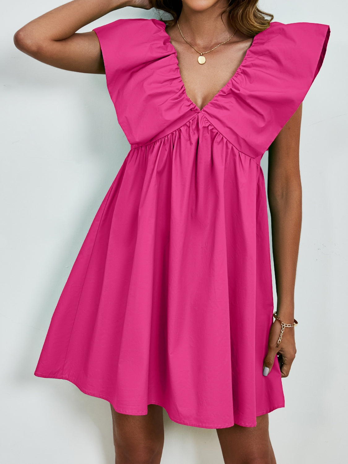 BELLA V-neck cap sleeve mini dress featuring a stylish and fitted design, perfect for casual or dressy occasions.