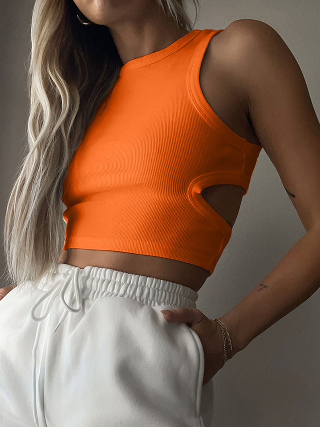 BELLA BLA trendsi cutout round neck tank top in black, featuring a sleeveless design with stylish cutout details on the front.