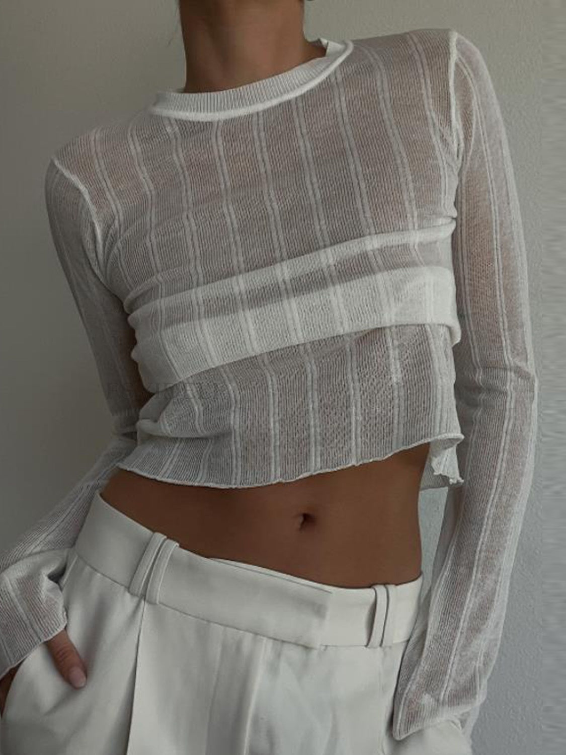 BELLA trendsi round neck long sleeve top, soft fabric, fitted style, in a neutral color, displayed on a hanger.
