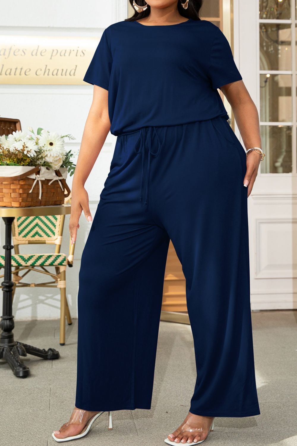 Plus size BELLA drawstring waist short sleeve jumpsuit, casual and comfortable summer jumpsuit with relaxed fit and stylish design.