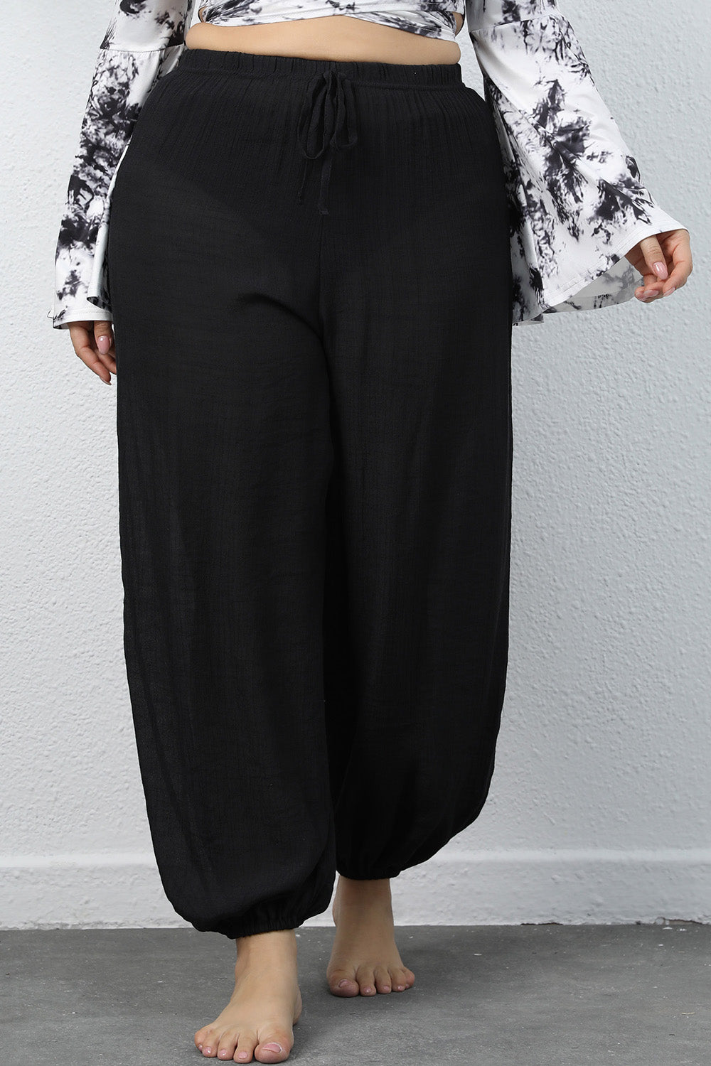 Plus size BELLA drawstring jogger pants with relaxed fit and elastic waistband, ideal for comfortable casual wear.