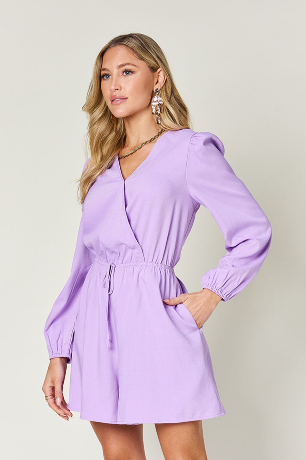 BELLA Trendsi double take full size drawstring long sleeve romper displayed on a model, featuring a casual fit and stylish design.