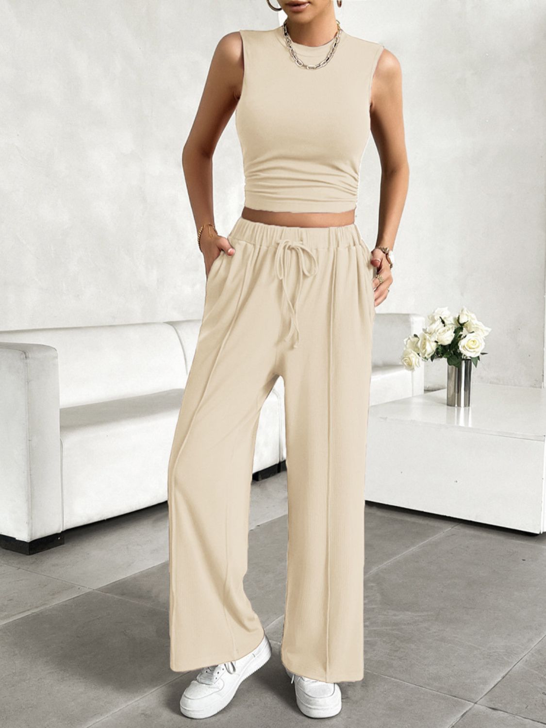 BELLA trendsi mock neck sleeveless top and drawstring pants set, stylish and casual outfit, shown on a model.