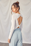 Bella Idem Ditto twisted backless long sleeve knit top, shown in a stylish design with a twisted back detail and fitted long sleeves.