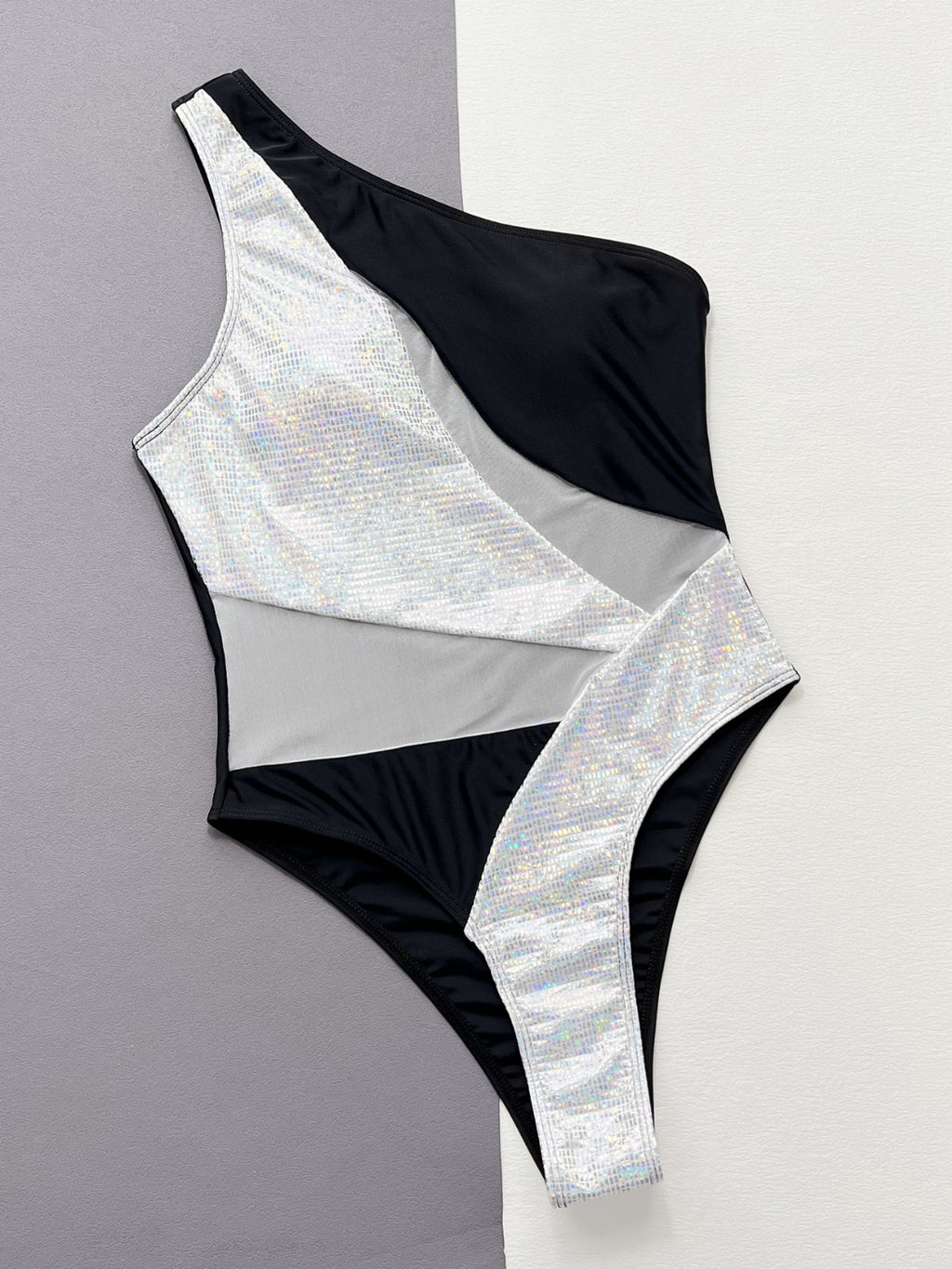 BELLA BLA contrast panel one-piece swimsuit featuring a sleek design and bold color blocking, perfect for beach or poolside wear.