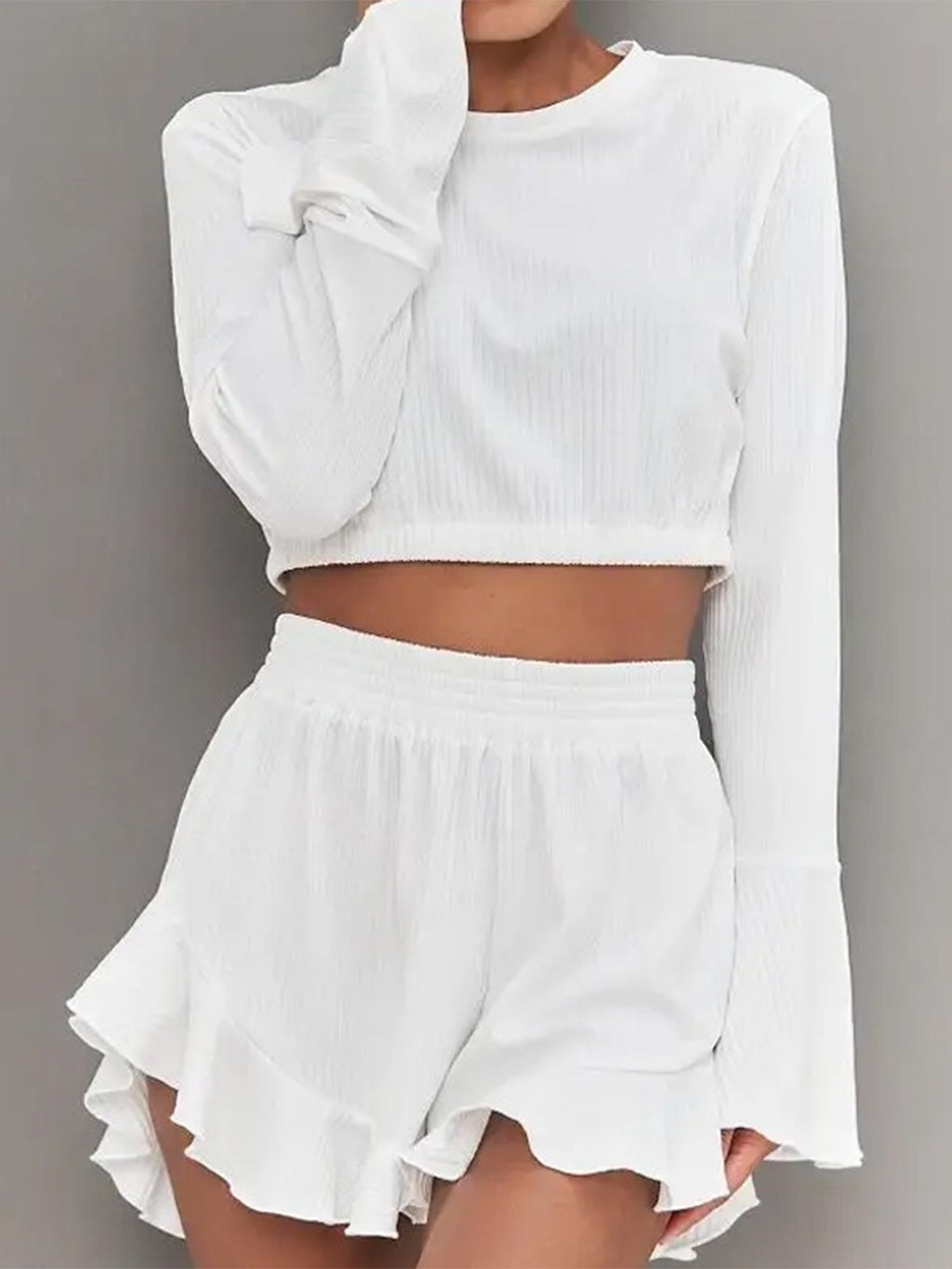 BELLA trendsi round neck long sleeve top and ruffled shorts set, featuring a stylish, comfortable matching outfit for casual wear.