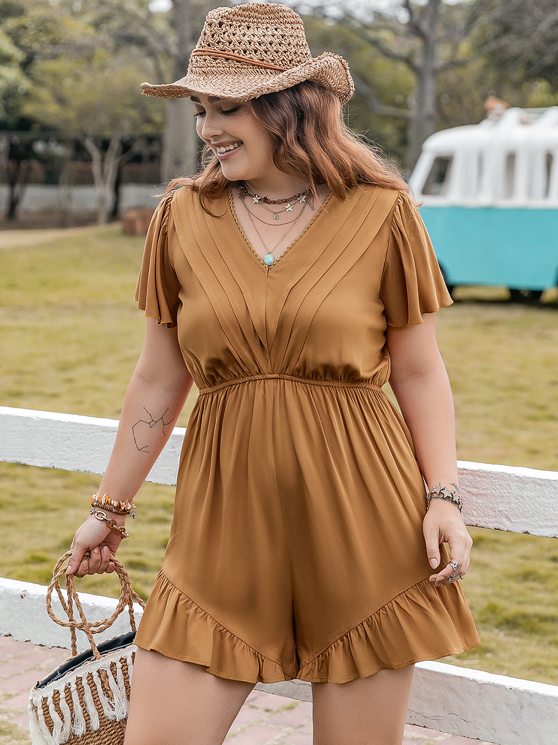 Plus size BELLA ruffled V-neck short sleeve romper with flowy fabric and stylish design, perfect for casual summer wear.