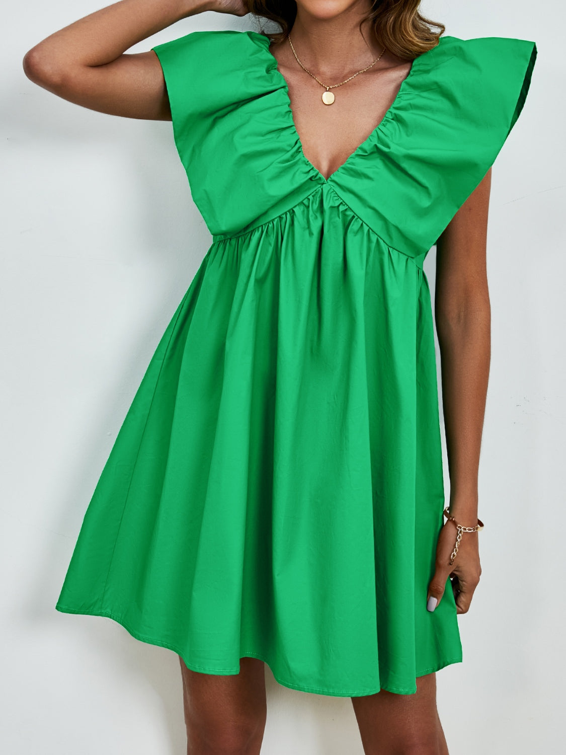BELLA V-neck cap sleeve mini dress featuring a stylish fit and trendy design, perfect for casual or semi-formal occasions.