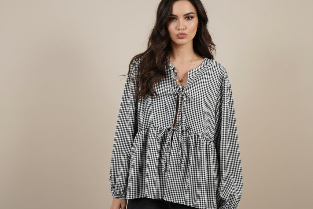 BELLA BLA tied round neck long sleeve blouse featuring a relaxed fit and soft fabric, styled with subtle detailing.