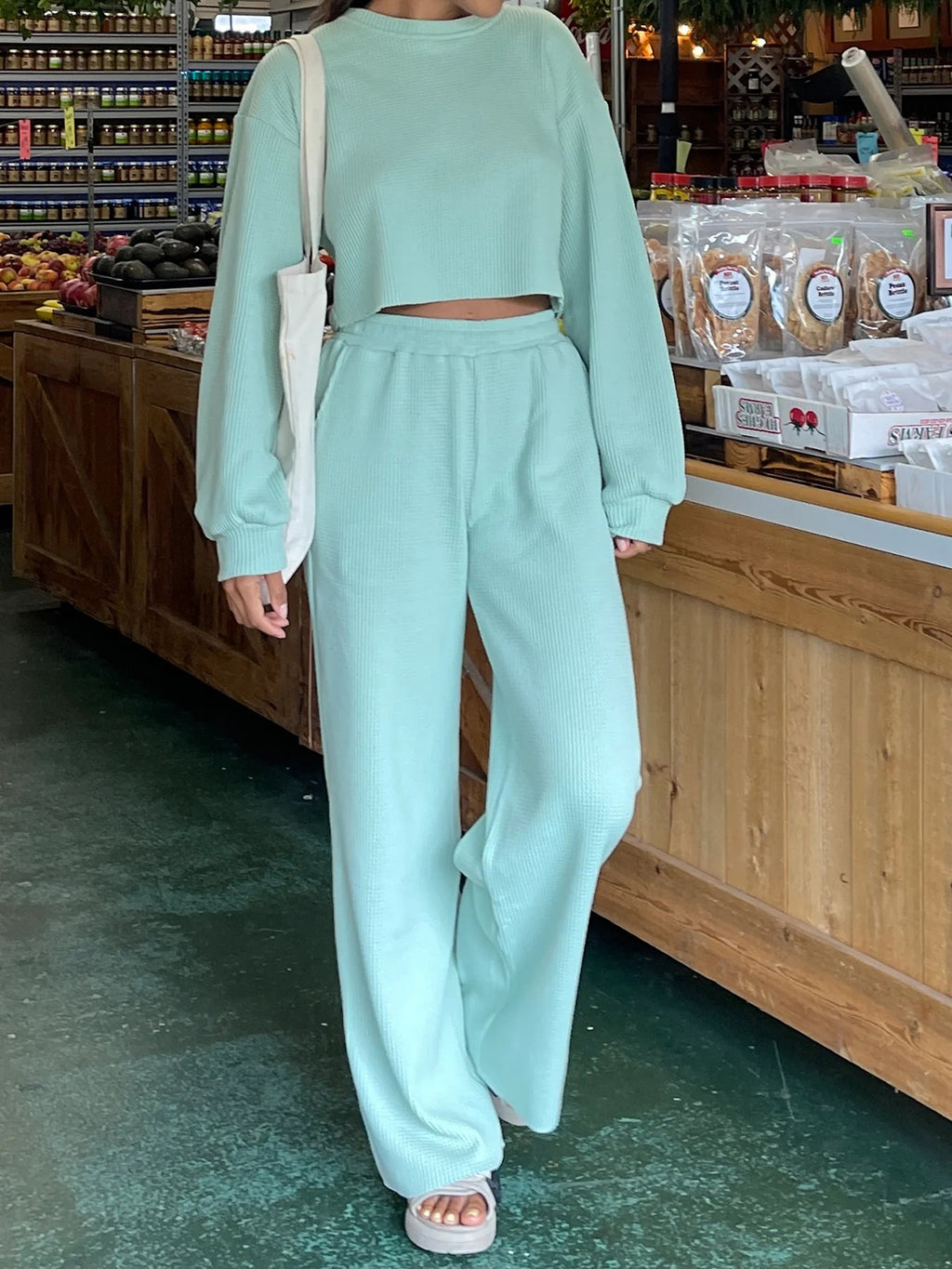BELLA waffle-knit round neck top and pants set featuring a cozy, textured fabric in a stylish, casual loungewear design.