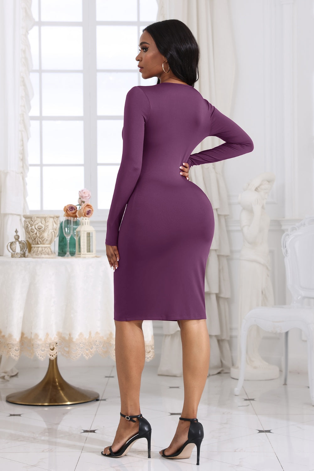 BELLA BLA Cutout Twisted Long Sleeve Dress from Trendsi featuring a stylish design with cutout details and twisted accents.