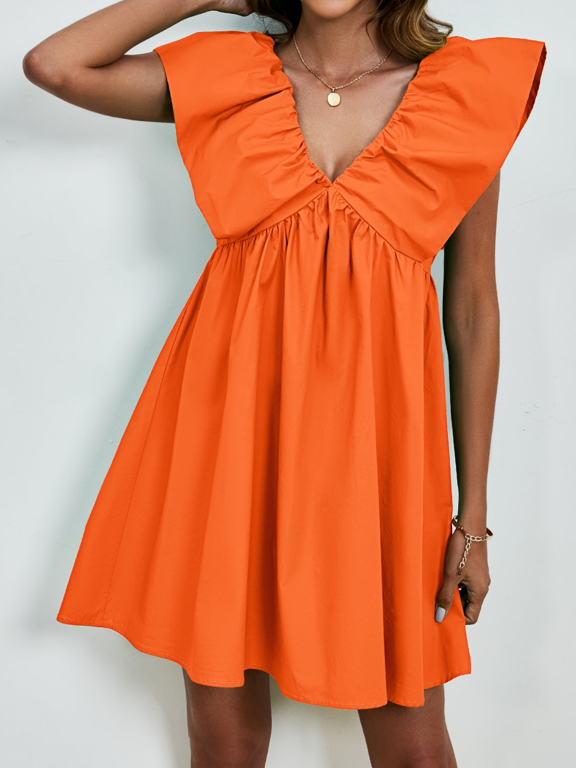 BELLA V-neck cap sleeve mini dress from trendsi featuring a stylish, fitted silhouette and soft fabric, perfect for casual or dressy occasions.
