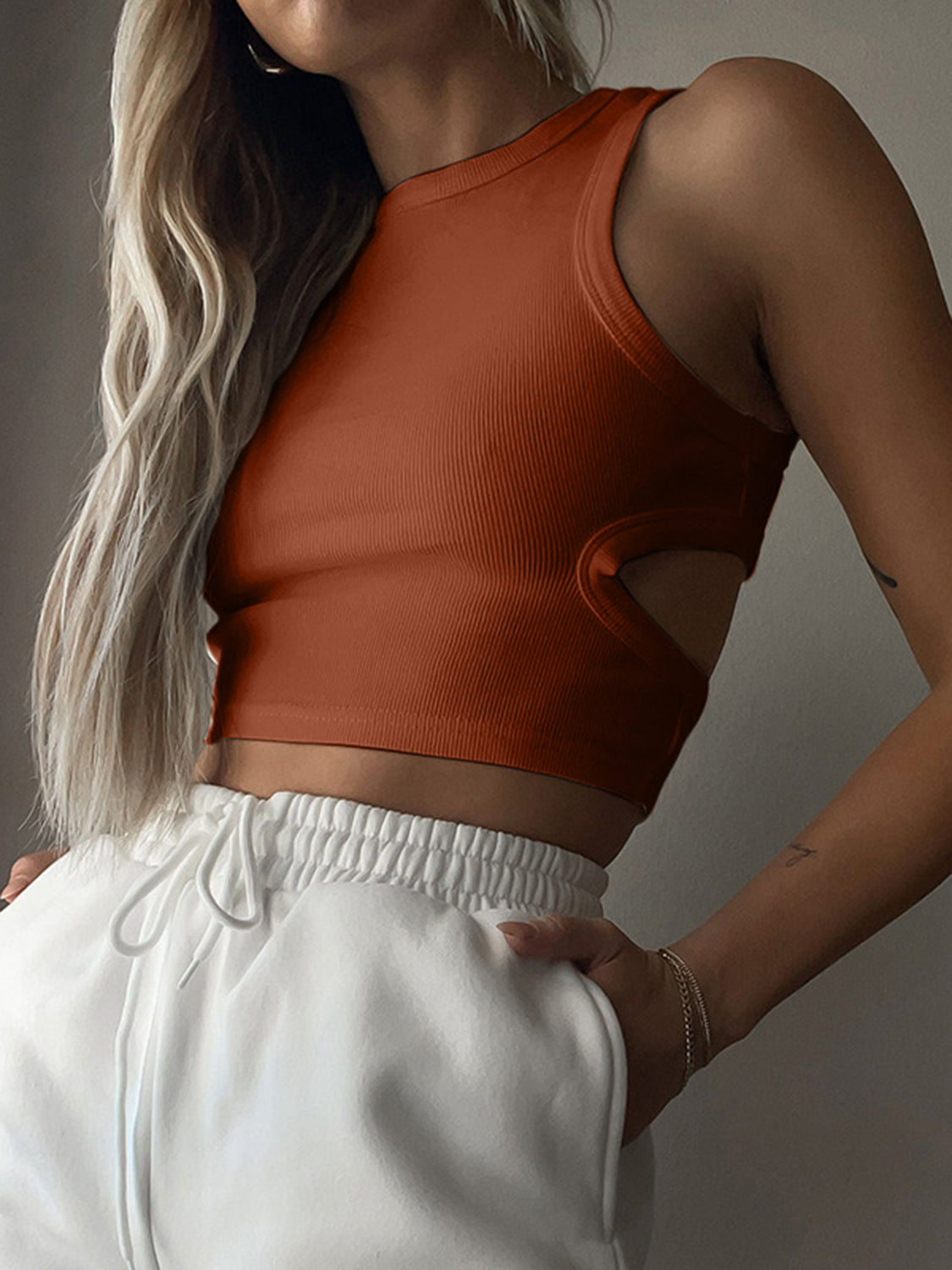 BELLA BLA trendsi cutout round neck tank top, showcasing a stylish sleeveless design with cutout details in a close-up view.