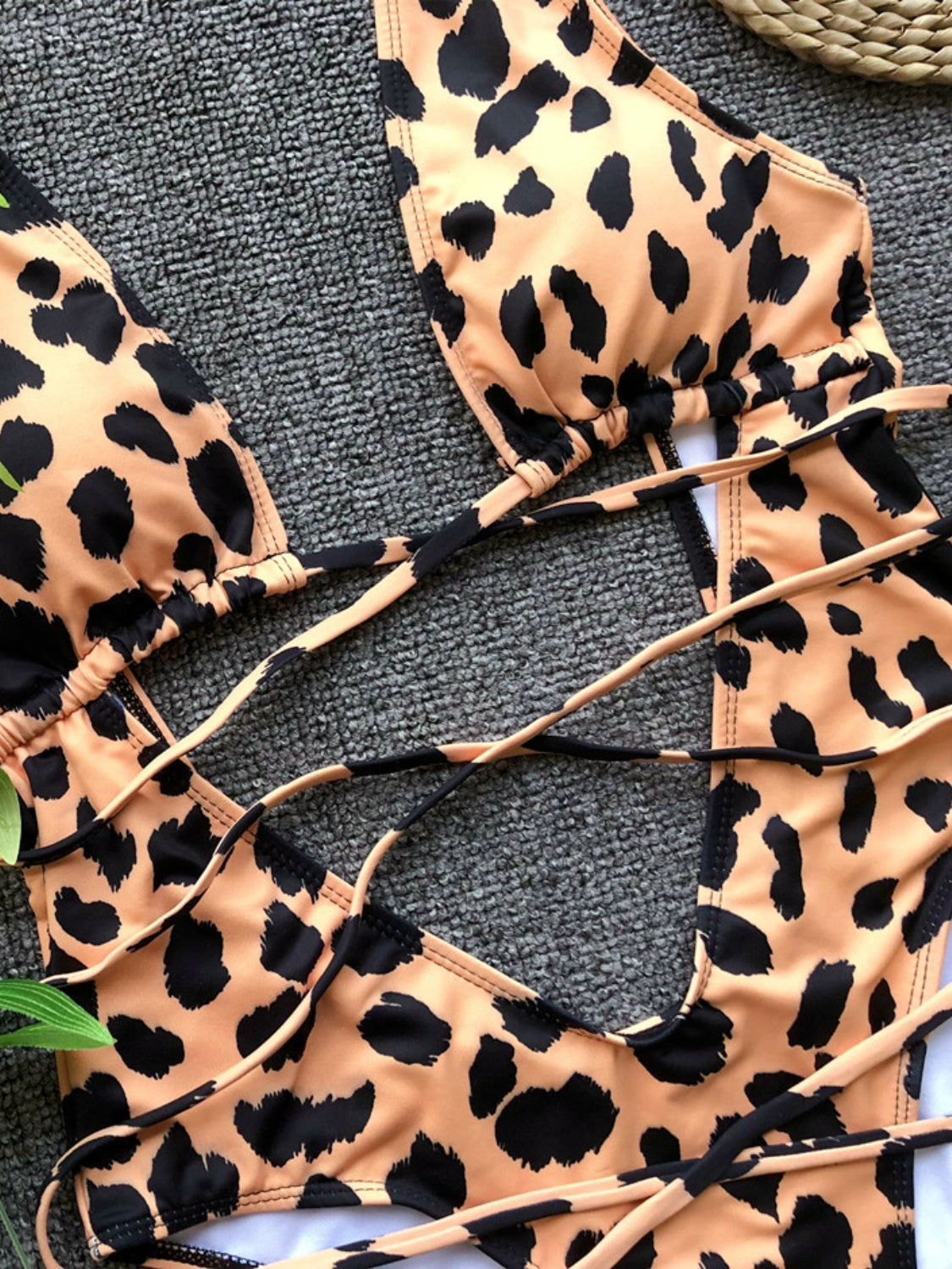 BELLA lace-up backless plunge one-piece swimwear featuring a stylish design and secure fit, perfect for beach or poolside wear.