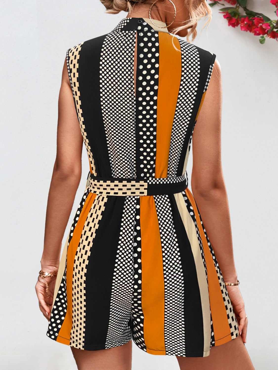 Color block sleeveless romper by BELLA, trendy tied design with vibrant color blocking, perfect for casual summer wear.