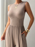 BELLA trendsi round neck sleeveless wide-leg jumpsuit displayed on a model, showcasing its relaxed fit and stylish design.