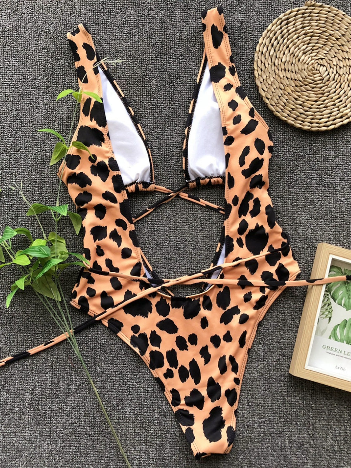 BELLA lace-up backless plunge one-piece swimwear with deep V neckline and sleek design, perfect for beach or poolside lounging.