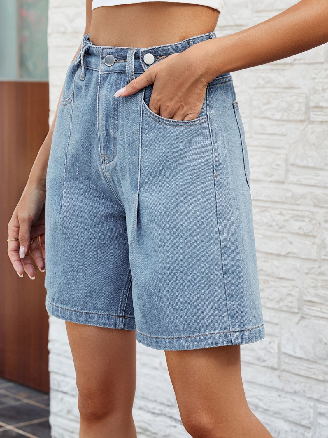 BELLA high waist denim shorts with front and back pockets, featuring a trendy fit and classic blue denim fabric.