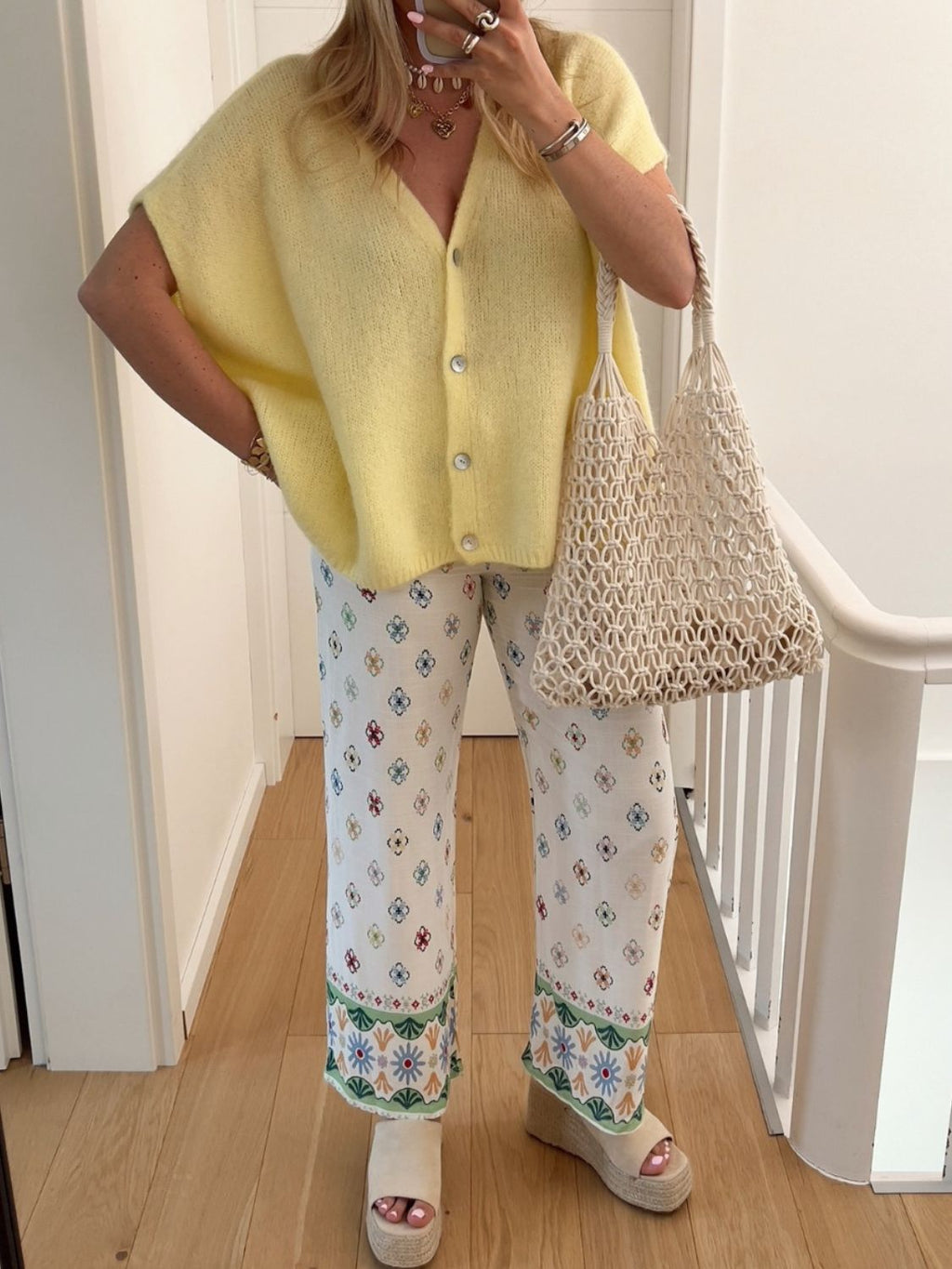 BELLA V-neck button-up short sleeve cardigan from trendsi, featuring a fitted design and lightweight knit fabric.