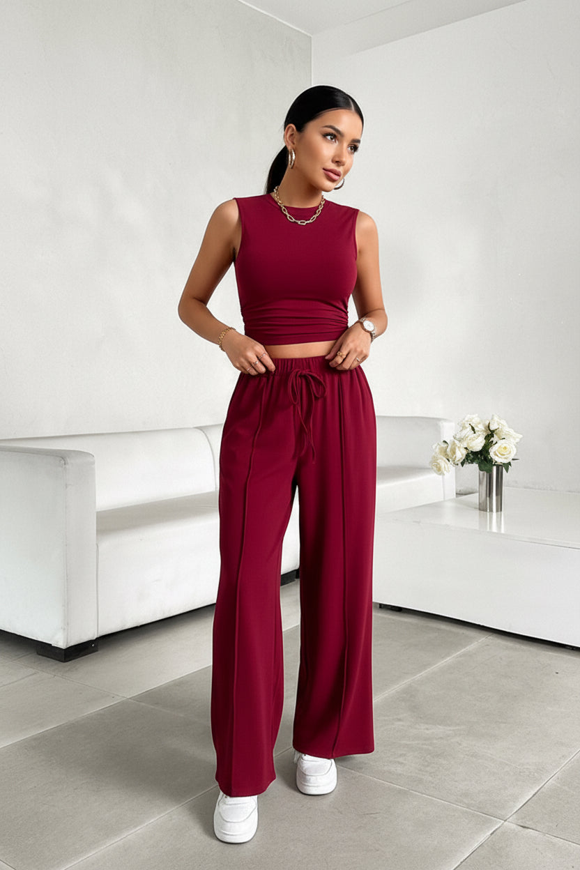 BELLA Trendsi sleeveless mock neck top and drawstring pants set in neutral fabric, displayed on a hanger.