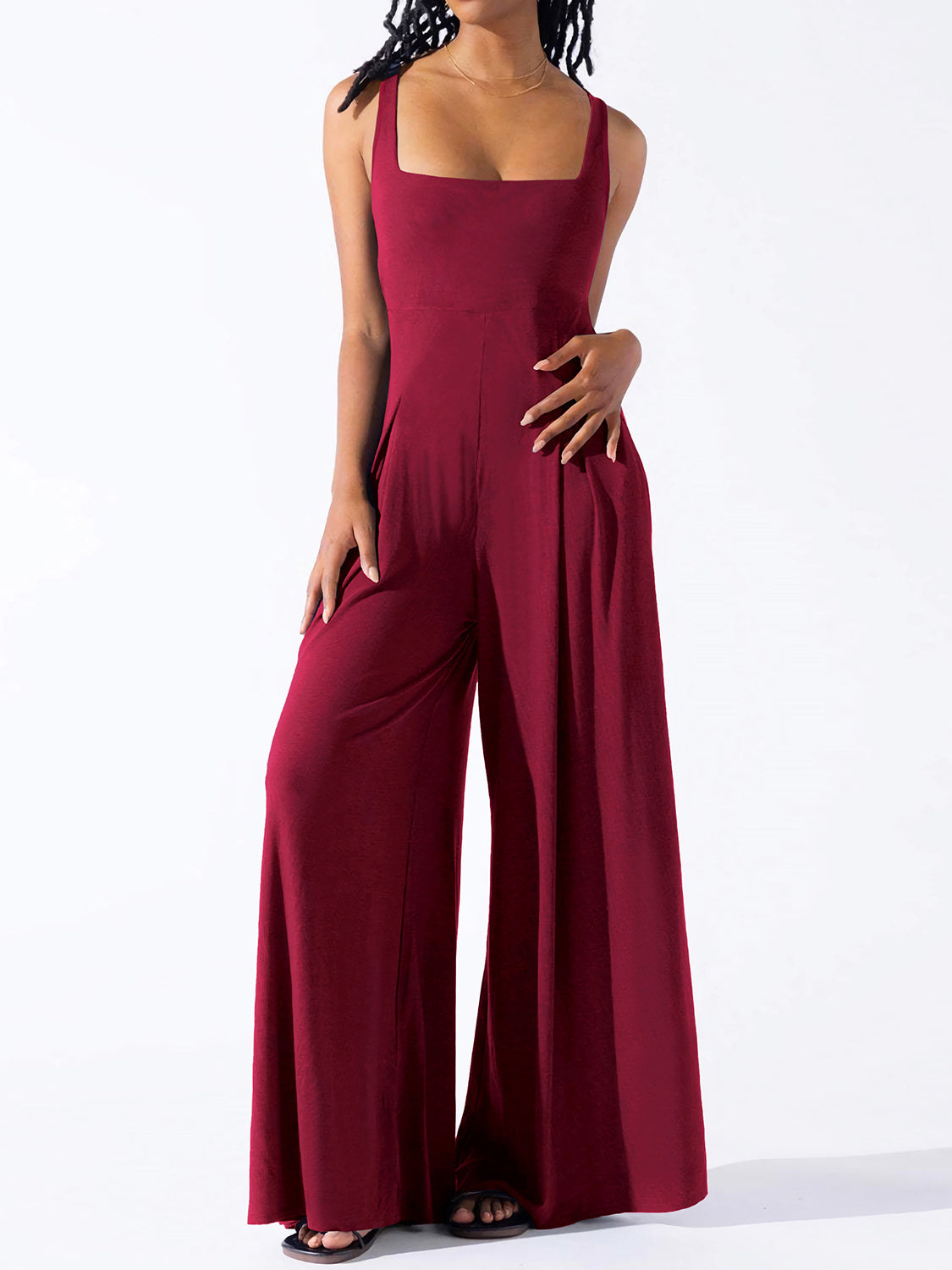 BELLA Square Neck Wide Strap Jumpsuit from Trendsi, featuring a stylish square neckline and wide shoulder straps, in a sleek design.