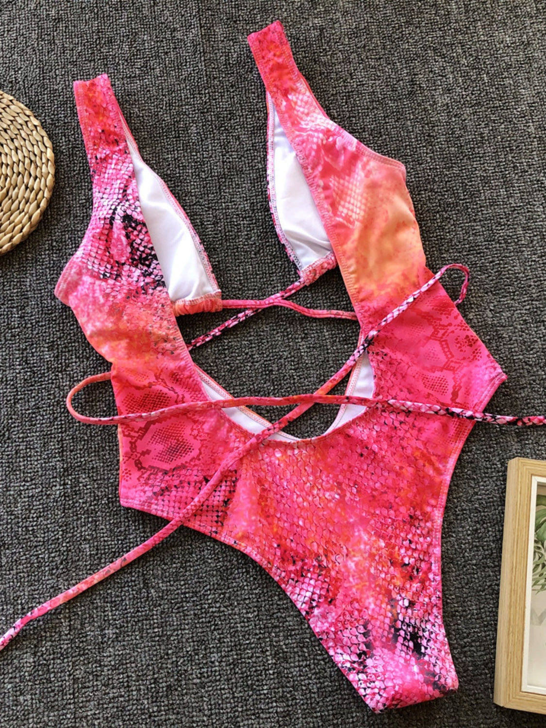 BELLA Lace-Up Backless Plunge One-Piece Swimwear featuring a daring design and stylish fit, perfect for beach and pool days.