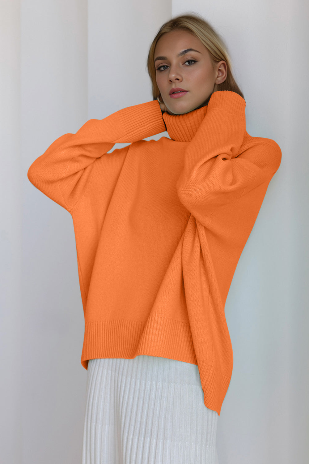 BELLA BLA turtleneck dropped shoulder long sleeve sweater with a cozy, fitted design and ribbed cuffs, shown in a neutral color.