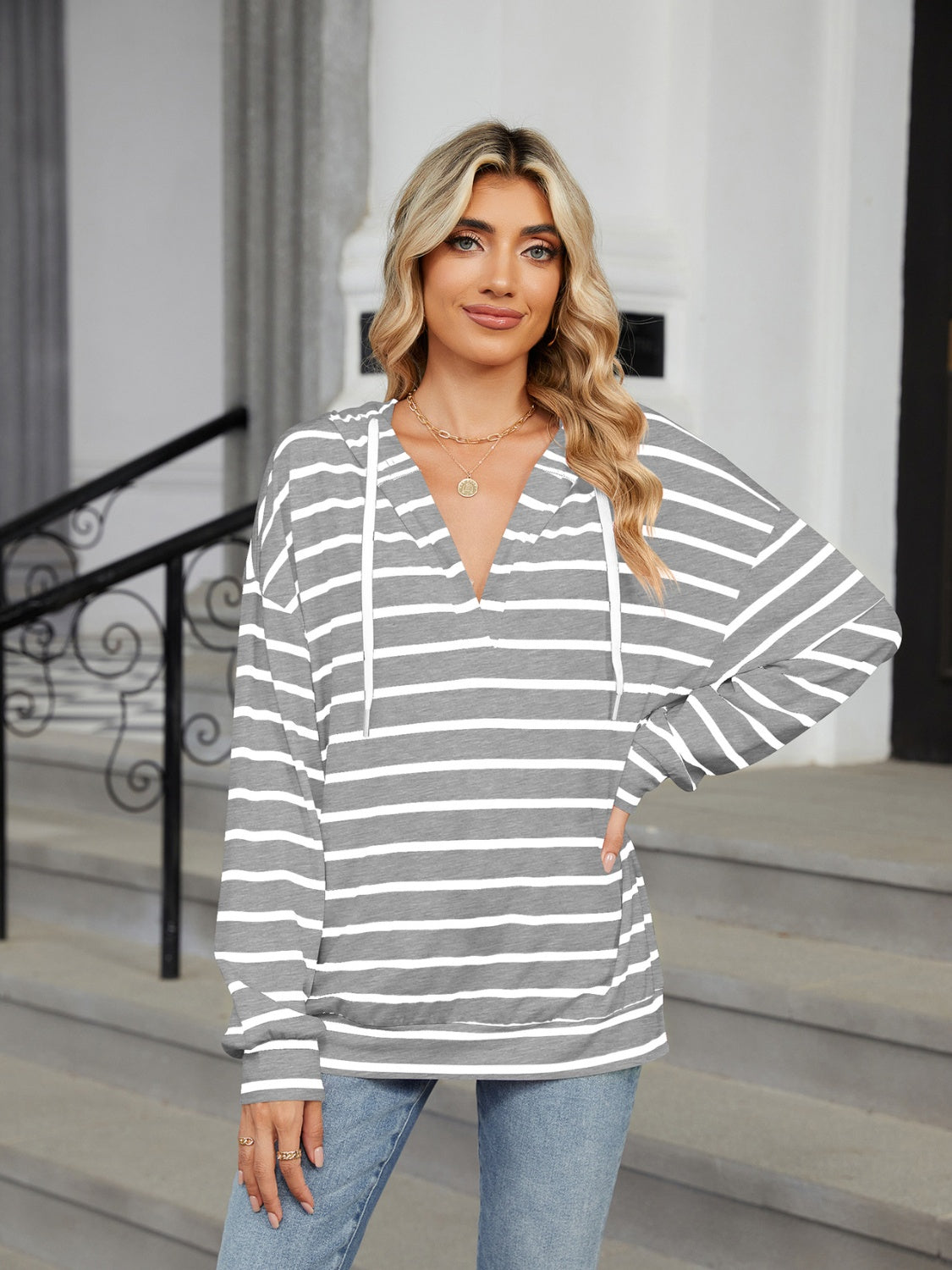 Bella Bla Drawstring Striped Long Sleeve Hoodie featuring a casual fit with horizontal stripe pattern and adjustable drawstring neckline.