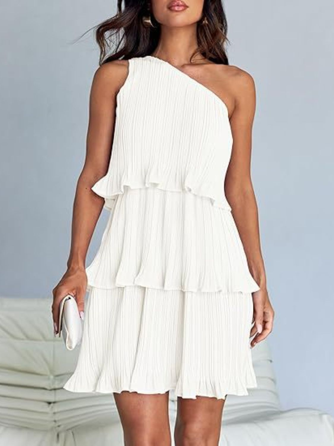 Bella layered single shoulder mini dress from Trendsi, featuring a stylish design with a single shoulder strap and layered detail.