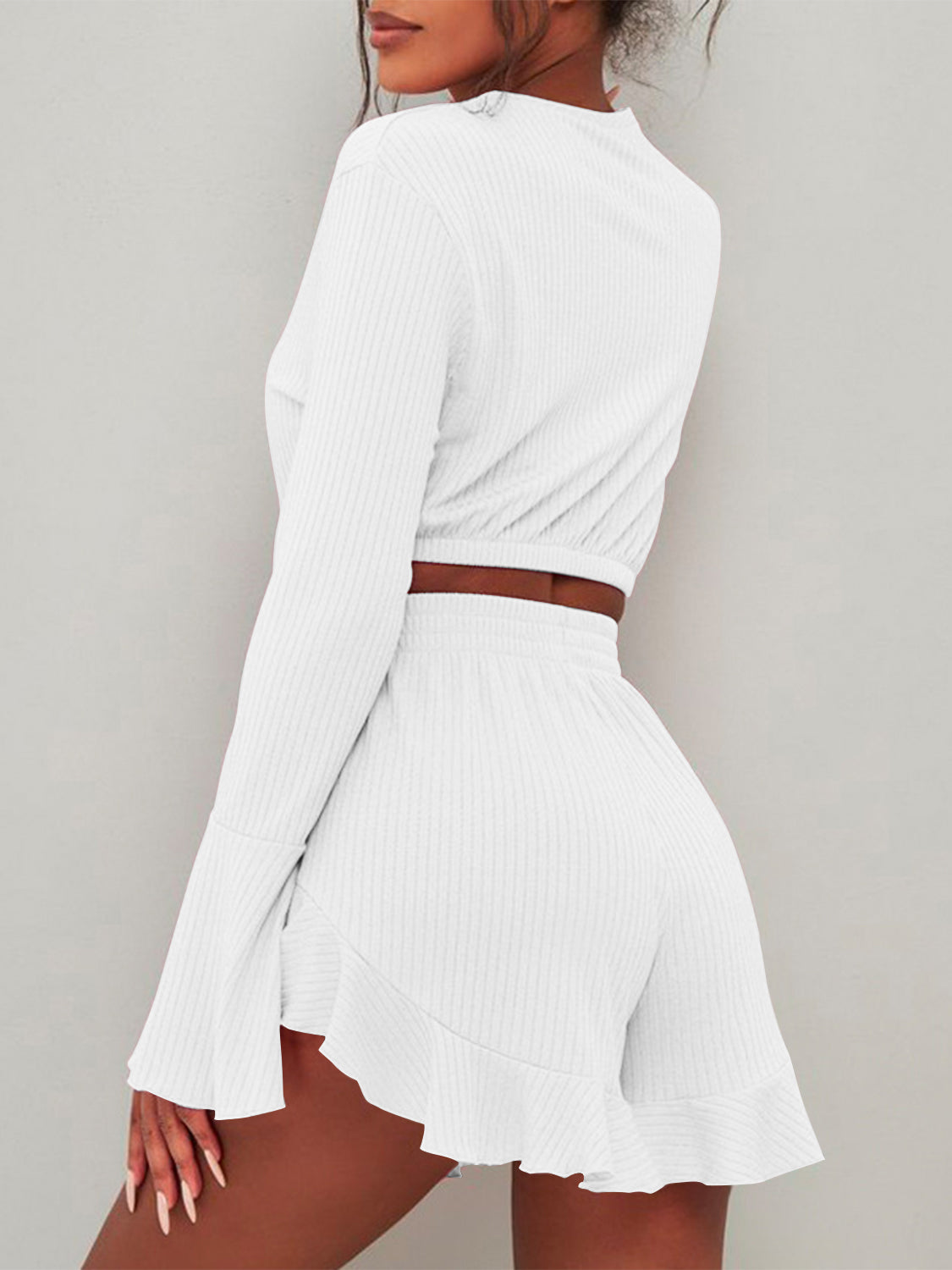 BELLA trendsi round neck long sleeve top and ruffled shorts set, featuring a stylish coordinated outfit with a comfortable fit.