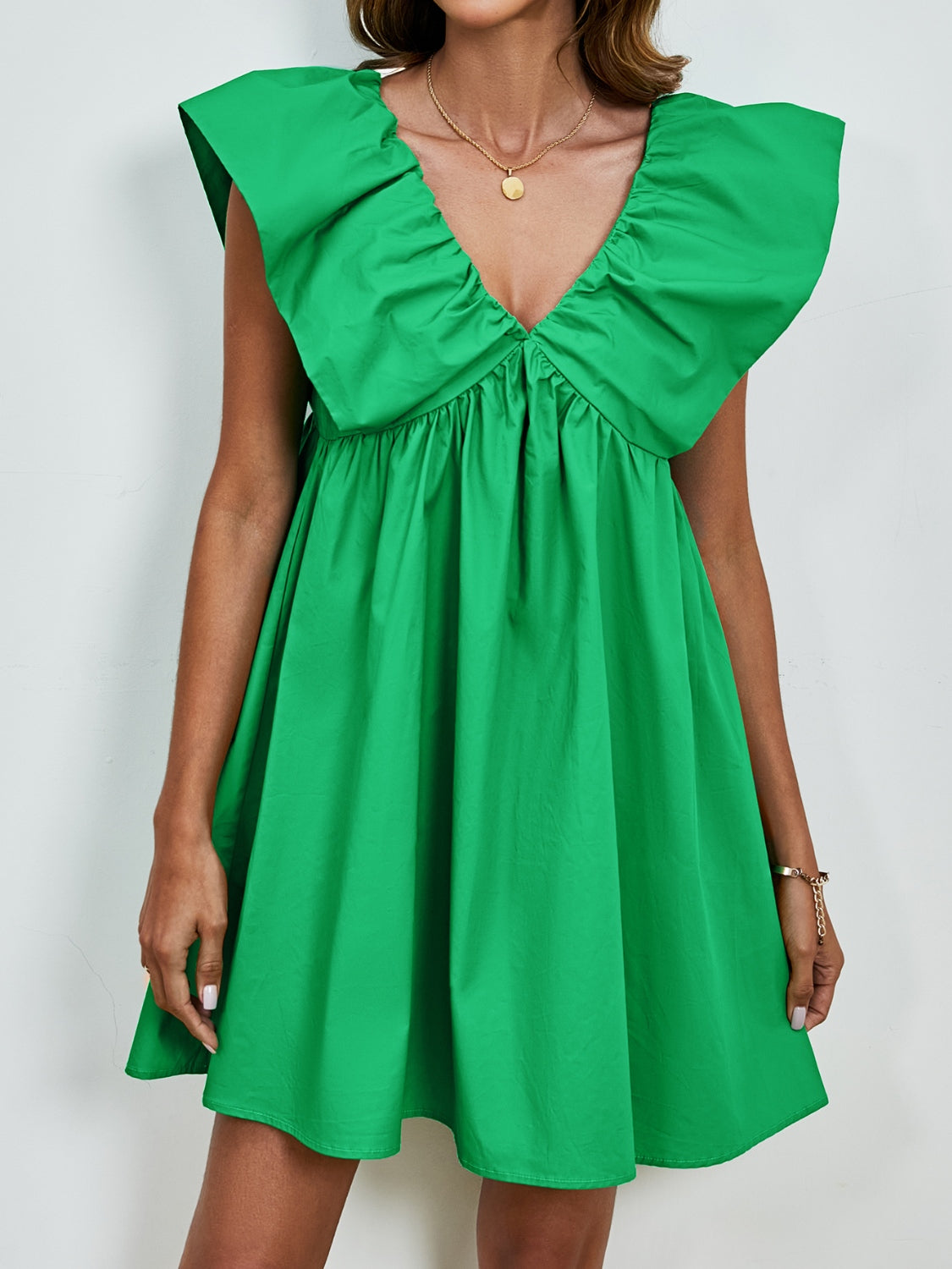 BELLA V-Neck Cap Sleeve Mini Dress in trendy fabric, featuring a fitted silhouette and stylish neckline, perfect for casual or dressy occasions.