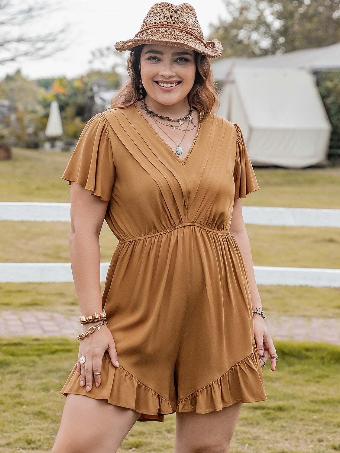 Plus size BELLA ruffled V-neck short sleeve romper with flowy fabric and stylish design, perfect for casual and summer wear.