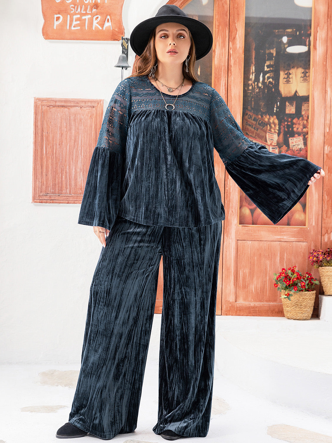 Plus size BELLA flare sleeve top and pants set with a round neck, displayed on a model, showcasing stylish and comfortable fashion.