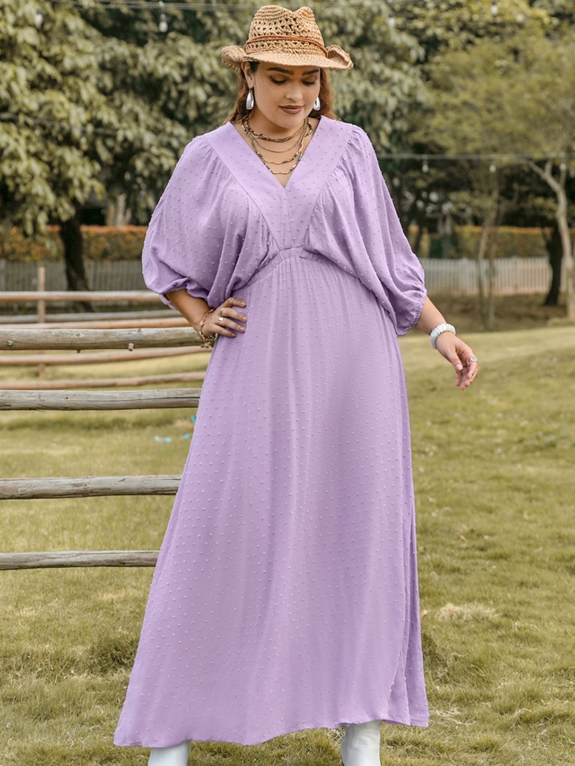 Plus size BELLA Swiss Dot V-Neck midi dress featuring a flowy silhouette and delicate dot pattern, perfect for elegant occasions.