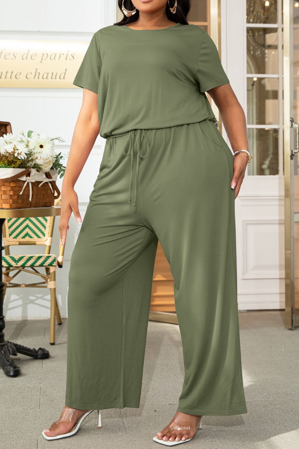 Plus size BELLA drawstring waist short sleeve jumpsuit, casual summer romper with a relaxed fit and comfortable design.